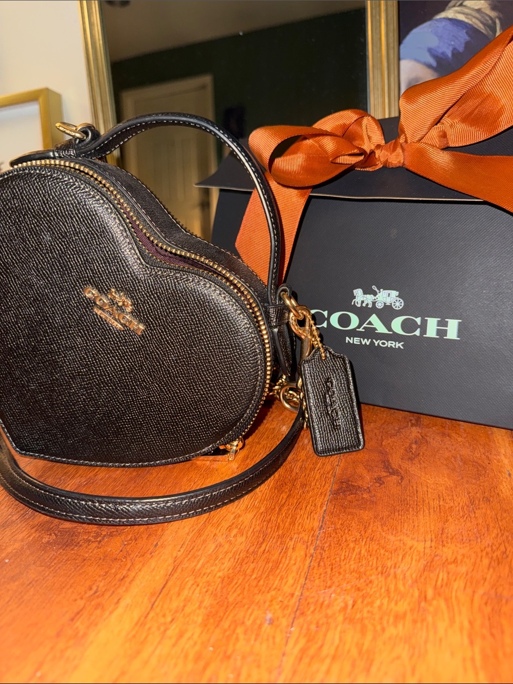 Coach Black Heart-Shaped Crossbody with Gold Hardware